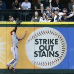 Arizona Diamondbacks left fielder Ender Inciarte leaps to catch a fly ball for an out hit by Seattle Mariners' Mike Zunino during the third inning of a baseball game on Monday, July 27, 2015, in Seattle. (AP Photo/John Froschauer)