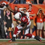 Arizona Cardinals running back Andre Ellington (38) celebrates his touchdown against the Denver Broncos during the first half of an NFL football game, Sunday, Oct. 5, 2014, in Denver. (AP Photo/Jack Dempsey)