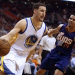 Golden State Warriors guard Klay Thompson (11) drives on Phoenix Suns guard Gerald Green in the first quarter during an NBA basketball game, Monday, March 9, 2015, in Phoenix. (AP Photo/Rick Scuteri)