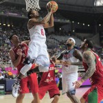 Derrick Rose of the U.S, third left, shoots over Mexico's Gustavo Ayon, second left, during Basketball World Cup Round of 16 match between United States and Mexico at the Palau Sant Jordi in Barcelona, Spain, Saturday, Sept. 6, 2014. The 2014 Basketball World Cup competition will take place in various cities in Spain from Aug. 30 through to Sept. 14. (AP Photo/Manu Fernandez)
