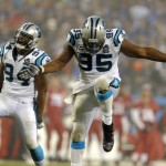 Carolina Panthers' Charles Johnson (95) and Kony Ealy (94) celebrate after a sack against the Arizona Cardinals in the second half of an NFL wild card playoff football game in Charlotte, N.C., Saturday, Jan. 3, 2015. The Panthers won 27-16. (AP Photo/Mike McCarn)