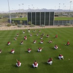 The Arizona Diamondbacks stretch during spring training baseball practice Sunday, Feb. 22, 2015, in Scottsdale, Ariz. (AP Photo/Darron Cummings)