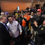 NFL commissioner Roger Goodell poses for photos with a football fan in Auditorium Theater during the third round of the 2015 NFL Football Draft, Friday, May 1, 2015, in Chicago. (AP Photo/Paul Beaty)