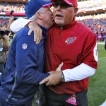 Denver Broncos head coach John Fox, left, greets Arizona Cardinals head coach Bruce Arians after an NFL football game, Sunday, Oct. 5, 2014, in Denver. The Broncos won 41-20. (AP Photo/Jack Dempsey)