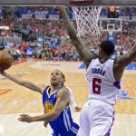 
Golden State Warriors guard Stephen Curry, left, puts up a shot as Los Angeles Clippers center DeAndre Jordan defends during the first half in Game 1 of an opening-round NBA basketball playoff series, Saturday, April 19, 2014, in Los Angeles. (AP Photo/Mark J. Terrill)