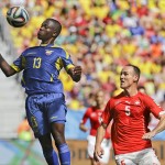 Ecuador's Enner Valencia, left, controls the ball watched by Switzerland's Steve von Bergen during the group E World Cup soccer match between Switzerland and Ecuador at the Estadio Nacional in Brasilia, Brazil, Sunday, June 15, 2014. (AP Photo/Martin Mejia)