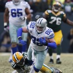 Green Bay Packers free safety Ha Ha Clinton-Dix (21) tackles Dallas Cowboys tight end Jason Witten (82) during the second half of an NFL divisional playoff football game Sunday, Jan. 11, 2015, in Green Bay, Wis. (AP Photo/Mike Roemer)