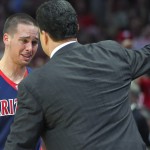 Arizona guard T.J. McConnell hugs head coach Sean Miller as he leaves the game against Wisconsin during the second half of a college basketball regional final in the NCAA Tournament, Saturday, March 28, 2015, in Los Angeles. Wisconsin beat Arizona 85-78 to advance to the Final Four. (AP Photo/Mark J. Terrill)