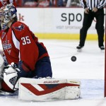 Washington Capitals goalie Justin Peters (35) pauses after a goal by Arizona Coyotes left wing Lauri Korpikoski, from Finland, bounces back out of the net in the second period of an NHL hockey game, Sunday, Nov. 2, 2014, in Washington. (AP Photo/Alex Brandon)
