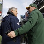 Green Bay Packers head coach Mike McCarthy, right, shakes hands with Seattle Seahawks head coach Pete Carroll before the NFL football NFC Championship game Sunday, Jan. 18, 2015, in Seattle. (AP Photo/David J. Phillip)