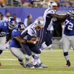 New York Giants' Mike Patterson, third from left, sacks New England Patriots quarterback Jimmy Garoppolo during the first half of an NFL preseason football game, Thursday, Aug. 28, 2014, in East Rutherford, N.J. (AP Photo/Bill Kostroun)