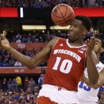Wisconsin's Nigel Hayes (10) grabs a rebound in front of Duke's Matt Jones, rear, during the first half of the NCAA Final Four college basketball tournament championship game Monday, April 6, 2015, in Indianapolis. (AP Photo/David J. Phillip)