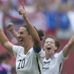 United States' Carli Lloyd, left, celebrates her goal with Meghan Klingenberg during the first half of the FIFA Women's World Cup soccer championship against Japan in Vancouver, British Columbia, Canada, Sunday, July 5, 2015. (Jonathan Hayward/The Canadian Press via AP) 