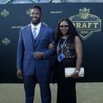 Texas A&M offensive lineman Cedric Ogbuehi poses for photos with his mother Kelly Ogbuehi, upon arriving for the first round of the 2015 NFL Football Draft at the Auditorium Theater of Roosevelt University, Thursday, April 30, 2015, in Chicago. (AP Photo/Charles Rex Arbogast)