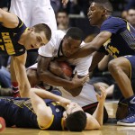 California's David Kravish, clockwise from left, Arizona's Rondae Hollis-Jefferson, California's Jordan Mathews and California's Sam Singer battle for the ball in the first half of an NCAA college basketball game in in the quarterfinals of the Pac-12 conference tournament Thursday, March 12, 2015, in Las Vegas. (AP Photo/John Locher)