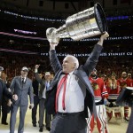 Chicago Blackhawks' head coach Joel Quenneville hoists the Stanley Cup after defeating the Tampa Bay Lightning in Game 6 of the NHL hockey Stanley Cup Final series on Wednesday, June 10, 2015, in Chicago. The Blackhawks defeated the Lightning 2-0 to win the series 4-2. (AP Photo/Nam Y. Huh)
