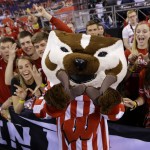 Wisconsin mascot cheers with fans before the NCAA Final Four college basketball tournament championship game between Wisconsin and Duke Monday, April 6, 2015, in Indianapolis. (AP Photo/Michael Conroy)