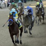 Victor Espinoza rides American Pharoah to victory in the 141st running of the Kentucky Derby horse race at Churchill Downs Saturday, May 2, 2015, in Louisville, Ky. (AP Photo/David J. Phillip)