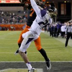 Washington defensive back Sidney Jones breaks up a pass in the end zone intended for Oklahoma State wide receiver Brandon Sheperd (7) during the second half of the Cactus Bowl NCAA college football game, Friday, Jan. 2, 2015, in Tempe, Ariz. (AP Photo/Rick Scuteri)