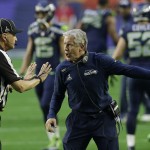 Seattle Seahawks head coach Pete Carroll argues with line judge Mark Perlman during the first half of NFL Super Bowl XLIX football game against the New England Patriots on Sunday, Feb. 1, 2015, in Glendale, Ariz. (AP Photo/Brynn Anderson)