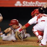 Los Angeles Angels catcher Carlos Perez, right, tags out Arizona Diamondbacks' Cliff Pennington, who tried to score from second base on a single by Paul Goldschmidt during the seventh inning of a baseball game in Anaheim, Calif., Monday, June 15, 2015. (AP Photo/Alex Gallardo)

