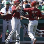Arizona Diamondbacks' Brandon Drury (62) is congratulated by Nick Ahmed after Drury hit a home run off San Francisco Giants' Madison Bumgarner in the second inning of a spring training exhibition baseball game Tuesday, March 17, 2015, in Scottsdale, Ariz. (AP Photo/Ben Margot)