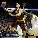  Arizona State center Jordan Bachynski (13) drives to the basket against Texas center Prince Ibeh (44) during the first half of a second round NCAA college basketball tournament game Thursday, March 20, 2014, in Milwaukee. (AP Photo/Morry Gash)
