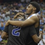 Georgia State forward Markus Crider, right, consoles teammate Ryann Green (2) after losing to Xavier 75-67 in an NCAA tournament third round college basketball game, Saturday, March 21, 2015, in Jacksonville, Fla. Xavier won 75-67. (AP Photo/Rick Wilson)