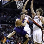  Phoenix Suns guard Goran Dragic, left, from Slovenia, looks to pass against Portland Trail Blazers' Robin Lopez, right, and Nicolas Batum, from France, during the first half of an NBA basketball game in Portland, Ore., Friday, April 4, 2014. (AP Photo/Don Ryan)