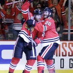 Chicago Blackhawks' Duncan Keith, left, is congratulated by teammate Brandon Saad after scoring a goal during the second period in Game 6 of the NHL hockey Stanley Cup Final series on against the Tampa Bay Lightning Monday, June 15, 2015, in Chicago. (AP Photo/Nam Y. Huh)