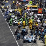 James Hinchcliffe, of Canada, (27) and others pit during the 98th running of the Indianapolis 500 IndyCar auto race at the Indianapolis Motor Speedway in Indianapolis, Sunday, May 25, 2014. (AP Photo/Darron Cummings)