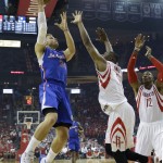 Los Angeles Clippers' Blake Griffin (32) shoots over Houston Rockets' Terrence Jones (6) and Dwight Howard (12) during the first half of Game 1 in a second-round NBA basketball playoff series Monday, May 4, 2015, in Houston. (AP Photo/David J. Phillip)