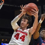 Wisconsin's Frank Kaminsky (44) grabs a rebound in front of Arizona's Stanley Johnson during the first half of a college basketball regional final in the NCAA Tournament, Saturday, March 28, 2015, in Los Angeles. (AP Photo/Mark J. Terrill)