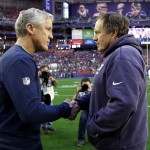 Seattle Seahawks head coach Pete Carroll, left, shakes hands with New England Patriots head coach Bill Belichick before the NFL Super Bowl XLIX football game Sunday, Feb. 1, 2015, in Glendale, Ariz. (AP Photo/David J. Phillip)
