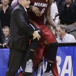 Miami Heat forward LeBron James (6) is carried to the bench after injuring himself against the San Antonio Spurs during the second half in Game 1 of the NBA basketball finals on Thursday, June 5, 2014 in San Antonio. (AP Photo/Eric Gay)