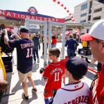 Fans pass through metal detectors at the stadium's center field gate before a baseball game between the Washington Nationals and the New York Mets on opening day at Nationals Park, Monday, April 6, 2015, in Washington. (AP Photo/Andrew Harnik)