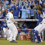 Kansas City Royals relief pitcher Greg Holland and catcher Salvador Perez celebrate after the Royals defeated the Baltimore Orioles 2-1 in Game 4 of the American League baseball championship series Wednesday, Oct. 15, 2014, in Kansas City, Mo. The Royals advance to the World Series. (AP Photo/Matt Slocum )