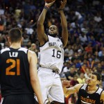 San Antonio Spurs' Jonathan Simmons shoots against the Phoenix Suns during the first half of an NBA summer league basketball game Monday, July 20, 2015, in Las Vegas. (AP Photo/John Locher)
