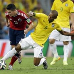 Colombia's James Rodriguez is tripped by Brazil's Fernandinho during the World Cup quarterfinal soccer match between Brazil and Colombia at the Arena Castelao in Fortaleza, Brazil, Friday, July 4, 2014. (AP Photo/Andre Penner)