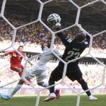 Belgium's Dries Mertens, left, scores his side's 2nd goal past Algeria's goalkeeper Rais M'Bolhi, right, during the group H World Cup soccer match between Belgium and Algeria at the Mineirao Stadium in Belo Horizonte, Brazil, Tuesday, June 17, 2014. (AP Photo/Hassan Ammar)