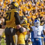Missouri wide receiver Bud Sasser, left, is hoisted in the air by teammate Evan Boehm after he scored a touchdown during the second quarter of an NCAA college football game against Kentucky, Saturday, Nov. 1, 2014, in Columbia, Mo. (AP Photo/L.G. Patterson)