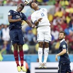 France's Yohan Cabaye (6) watches as France's Paul Pogba goes up against Honduras' Carlo Costly to head the ball during the group E World Cup soccer match between France and Honduras at the Estadio Beira-Rio in Porto Alegre, Brazil, Sunday, June 15, 2014. (AP Photo/Martin Meissner)