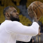 Cleveland Cavaliers forward LeBron James warms up before Game 5 of basketball's NBA Finals against the Golden State Warriors in Oakland, Calif., Sunday, June 14, 2015. (AP Photo/Ben Margot)
