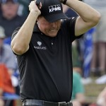 Phil Mickelson reacts after missing an eagle putt on the seventh hole during the final round of the PGA Championship golf tournament at Valhalla Golf Club on Sunday, Aug. 10, 2014, in Louisville, Ky. (AP Photo/David J. Phillip)