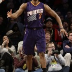 Phoenix Suns' Brandon Knight (3) celebrates after making a basket during the overtime period of an NBA basketball game against the Brooklyn Nets, Friday, March 6, 2015, in New York. The Suns won the game 108-100. (AP Photo/Frank Franklin II)
