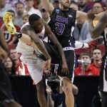 Utah guard Delon Wright, left, collides with Stephen F. Austin forward Tanner Clayton during the second half of an NCAA college basketball second-round game in Portland, Ore., Thursday, March 19, 2015. (AP Photo/Craig Mitchelldyer)