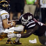 Southern Mississippi quarterback Nick Mullens (9) is sacked by Mississippi State defensive lineman Nelson Adams (94) in the second half of an NCAA college football game at Davis Wade Stadium in Starkville, Miss., Saturday, Aug. 30, 2014. Mississippi State won the season opener, 49-0. (AP Photo/Rogelio V. Solis)