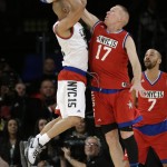 Chris Mullin, right, defends Common during the first half of the NBA All-Star celebrity basketball game Friday, Feb. 13, 2015, in New York. (AP Photo/Frank Franklin II)