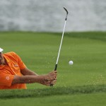 Rickie Fowler hits out of the bunker on the seventh hole during the final round of the PGA Championship golf tournament at Valhalla Golf Club on Sunday, Aug. 10, 2014, in Louisville, Ky. (AP Photo/David J. Phillip)