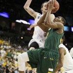  North Dakota State's Kory Brown, right, shoots against San Diego State's Aqeel Quinn in the first half during the third-round game of the NCAA men's college basketball tournament in Spokane, Wash., Saturday, March 22, 2014. (AP Photo/Young Kwak)